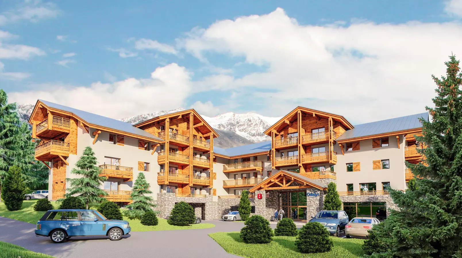 Résidence de standing Le Mont d’Auron avec façade bois et pierre, nichée au cœur des montagnes, offrant confort, balcons privatifs et stationnement.